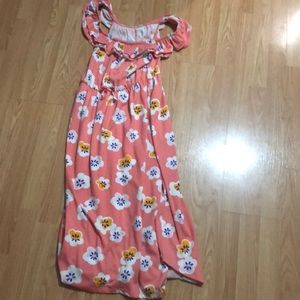 A flower. off the shoulder pink dress